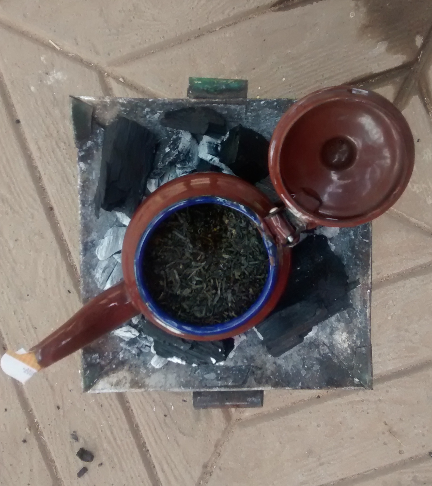 Green tea brewing in progress. 1st cass (glass) of three. This stuff is strong and addictive, bitter yet delicious.