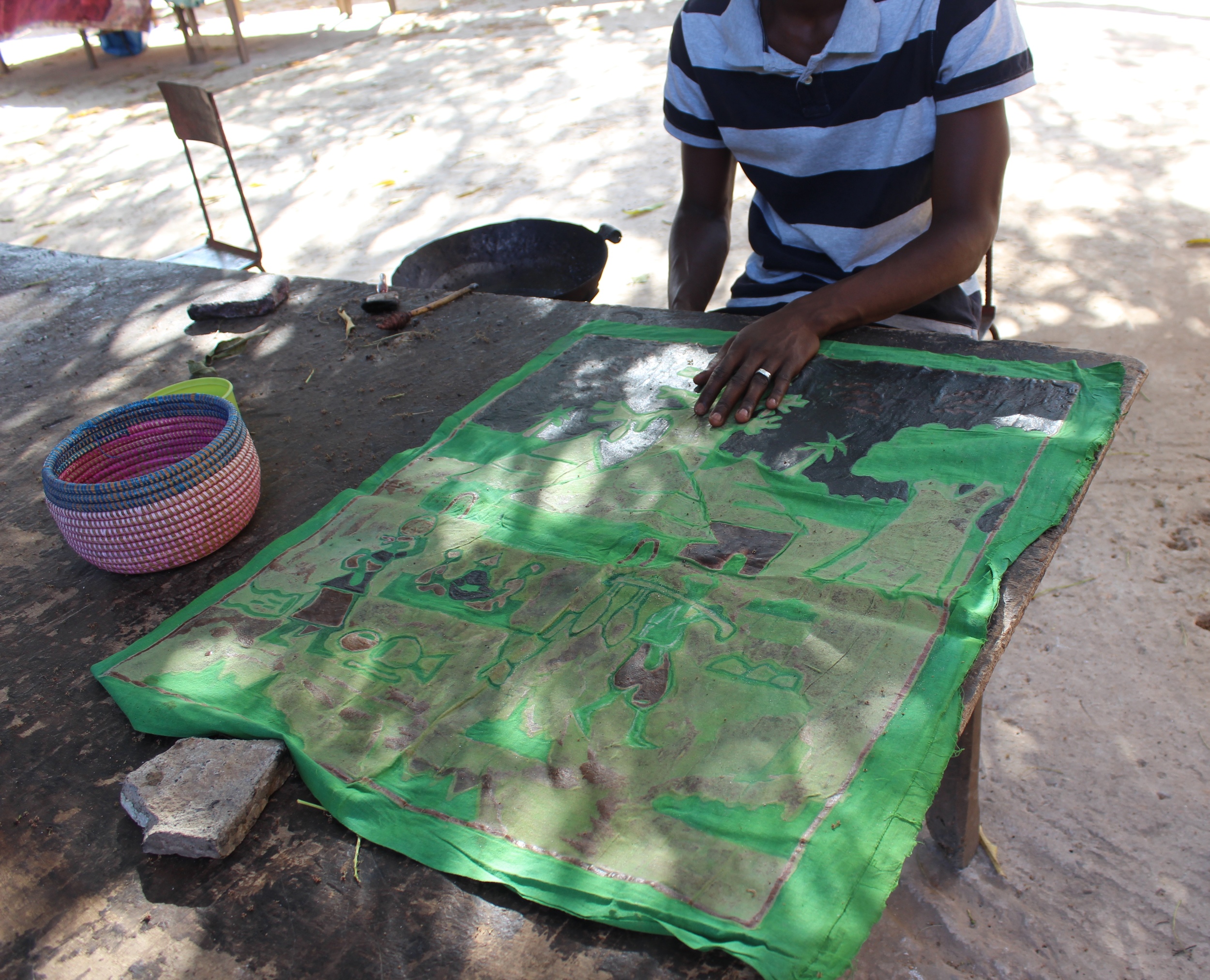 The Batik Factory in Serrekunda is a family business. Batik in process - applying a layer of wax to the cloth.
