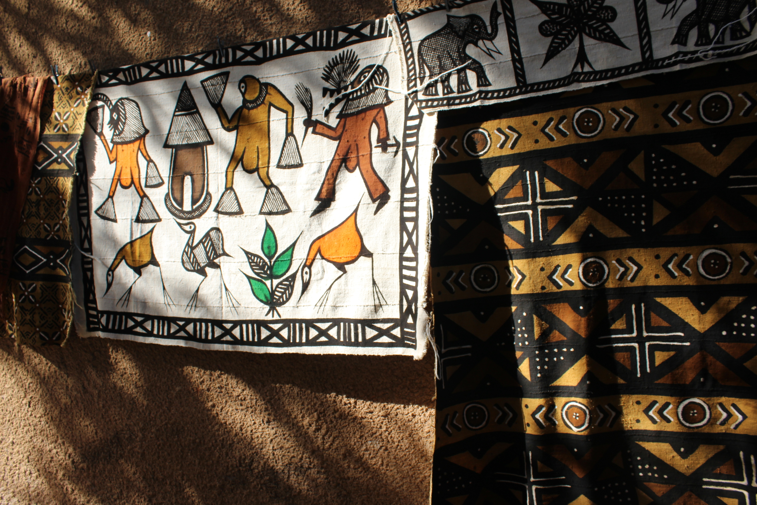 Mud cloth drying in the sun. These might be used as Wall hangings or rugs or for heavier clothing.