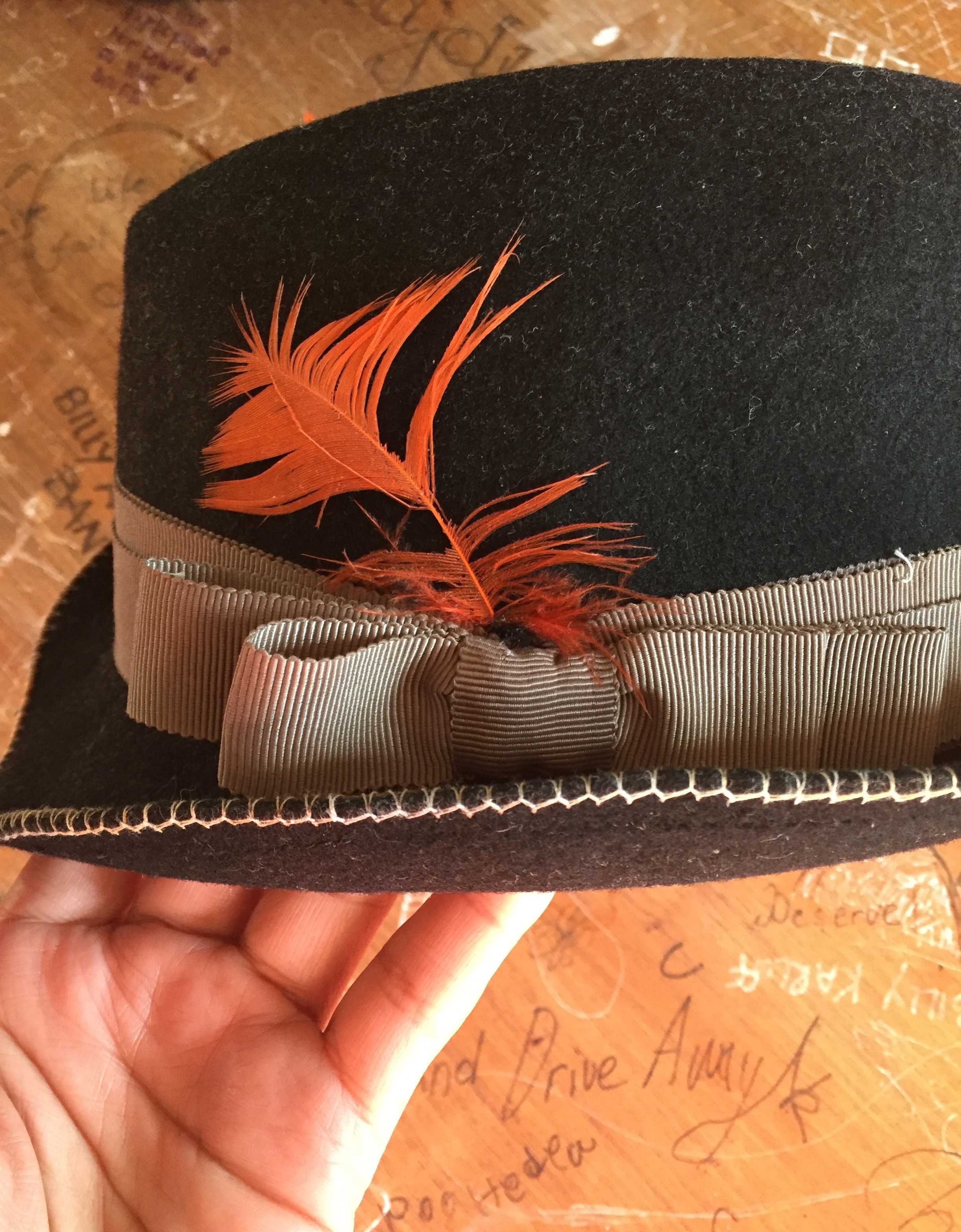 The original orange feather remains.